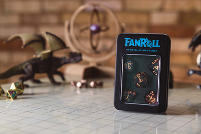 Tin with 'Fanroll' logo containing a red dice set on a background with gaming materials